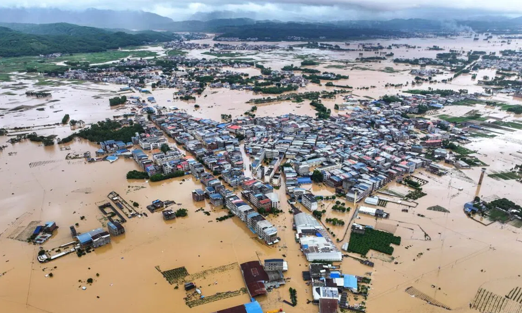 A breach in the dam body of Liulan Reservoir in Hengzhou, Nanning, Guangxi, China, and overtopping at Liuwang Reservoir in Binyang County